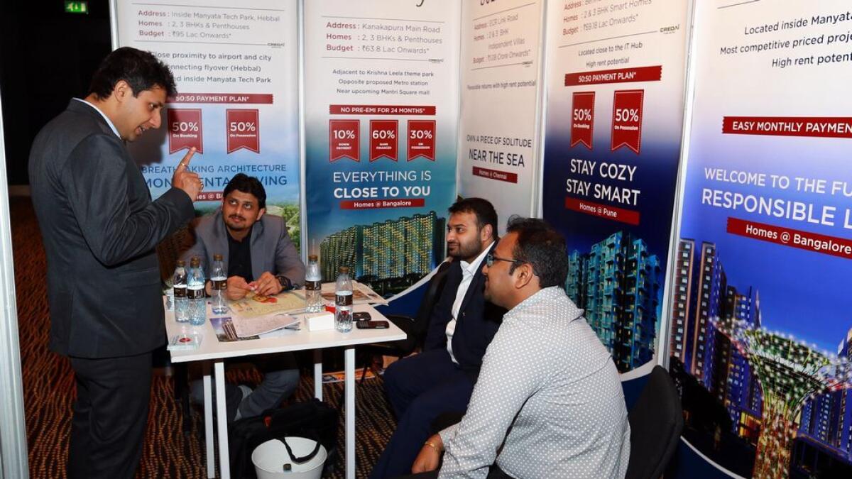 Customers listening to property agents at the Indian Real Estate Show in Abu Dhabi on Friday.