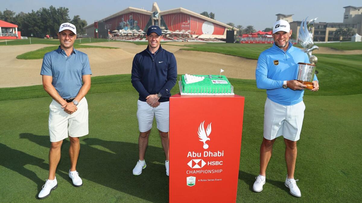 Justin Thomas, Rory McIlroy and defending champion Lee Westwood pose for a photograph with a cake to celebrate the 50th Anniversary of the UAE during practice ahead of the Abu Dhabi HSBC Championship at Abu Dhabi Golf Club. — Supplied photo
