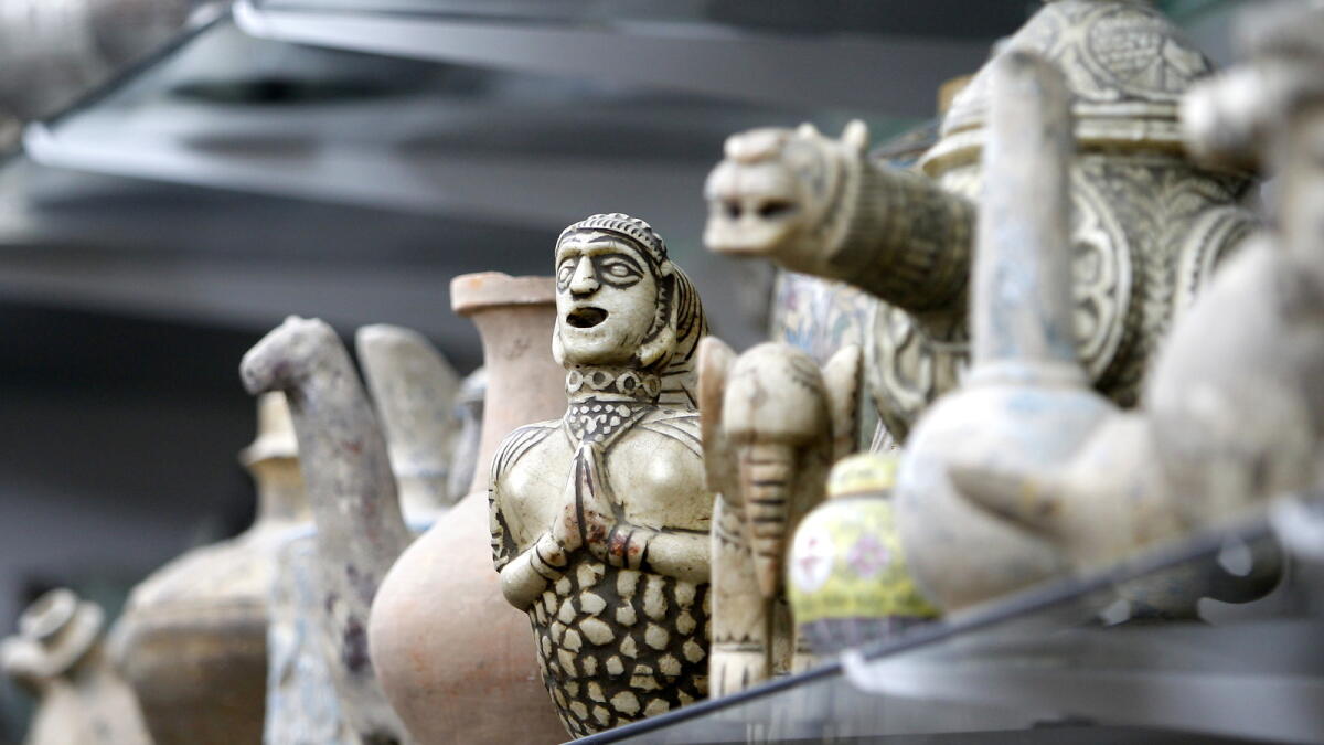 OLDER THAN YOU... An antique figurine that’s priced at thousands of dirhams — the souq is full of these ancient artefacts.