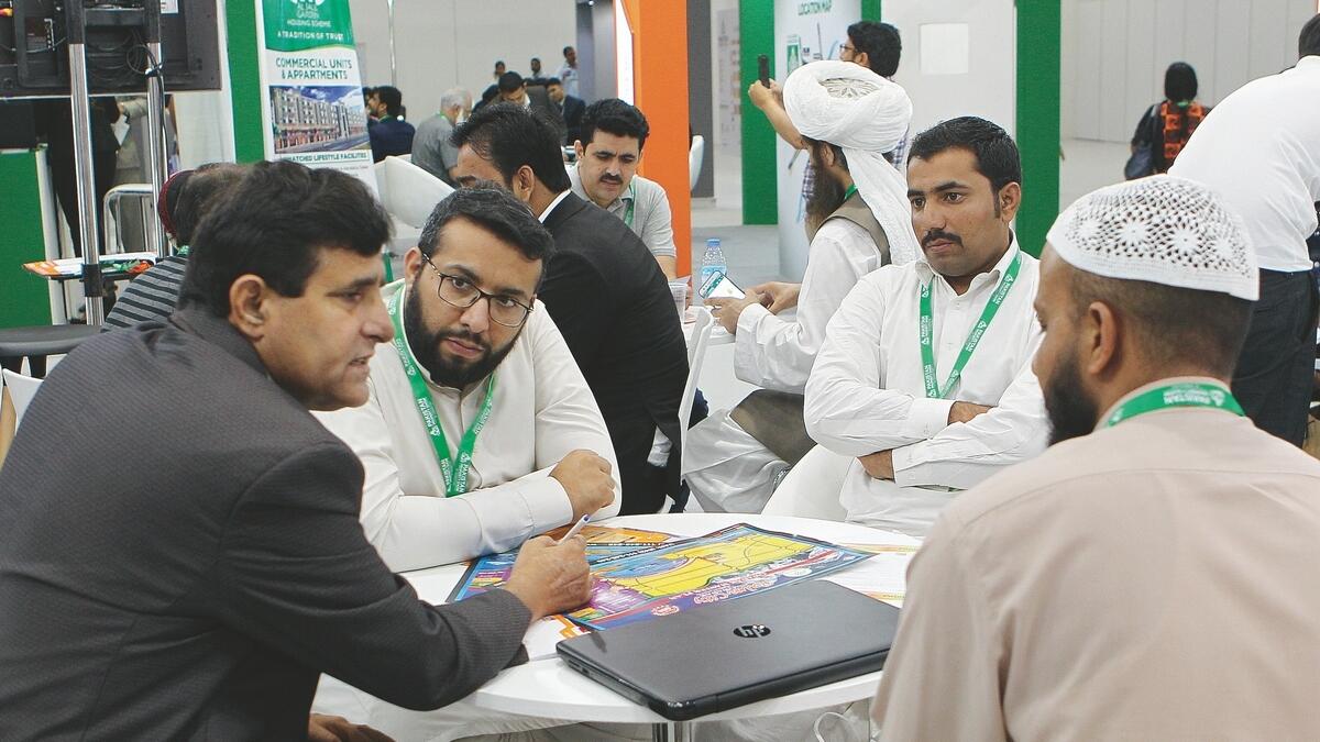 Visitors flock stands of real estate companies during the Pakistan Property Show at the Dubai World Trade Centre on Friday.