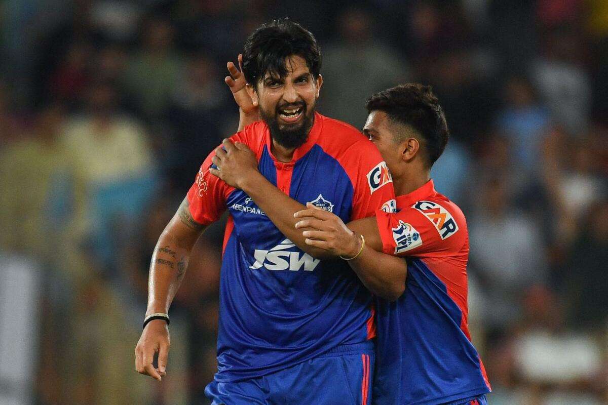 Delhi Capitals' Ishant Sharma (left) celebrates with his teammate after winning the  match against Gujarat Titans. — AFP