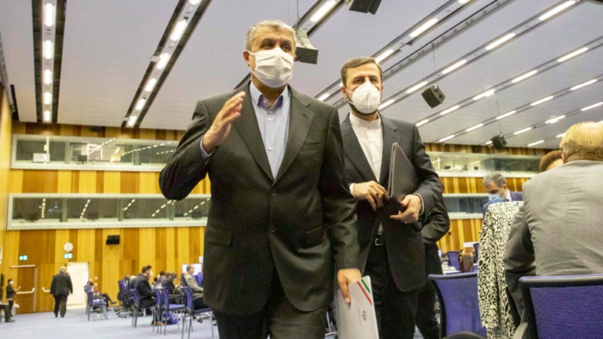 FILE - Mohammad Eslami, new head of Iran's nuclear agency, and Kazem Gharib Abadi, Iran's Governor to the International Atomic Energy Agency , leave the IAEA General Conference in Vienna. — AP