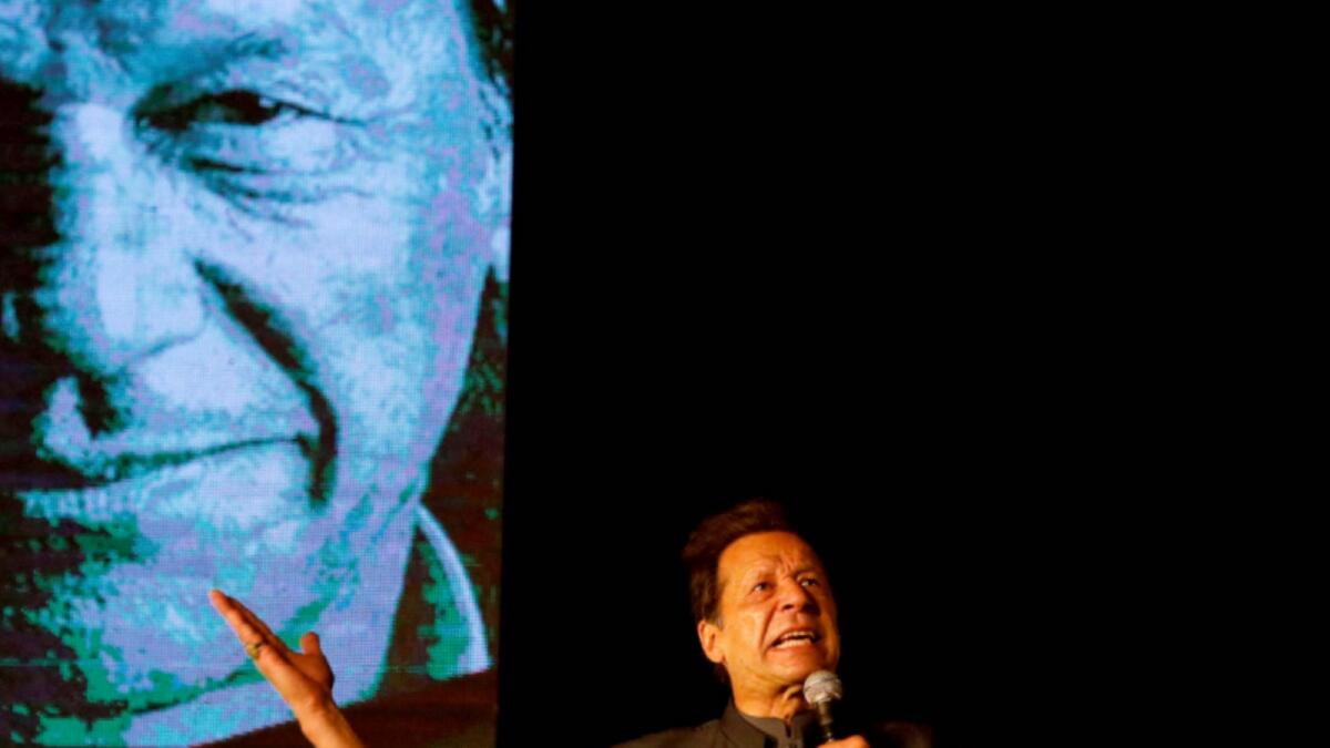 Imran Khan speaks at a rally in Karachi. — Reuters
