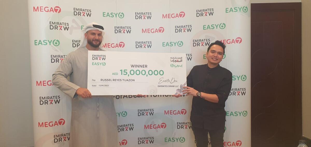 Russel Reyes with his winning cheque. Photo: Supplied
