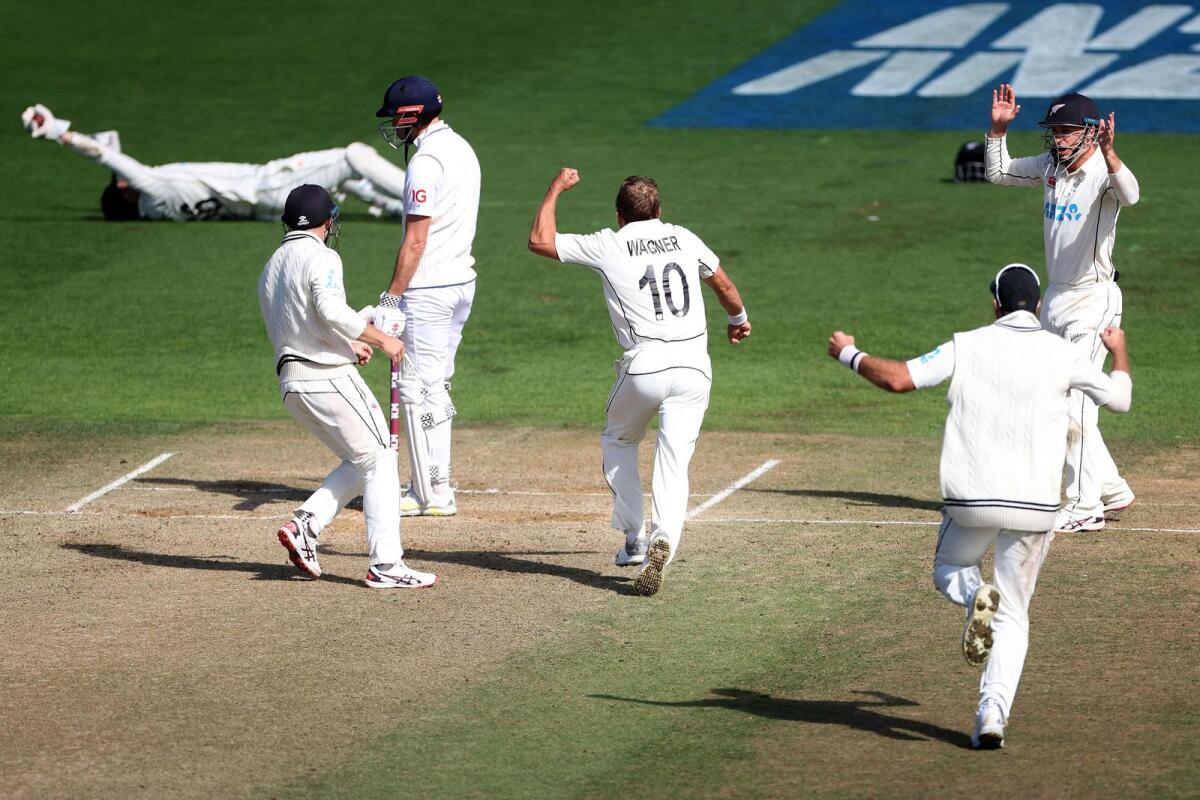 New Zealand's Neil Wagner (centre) celebrates taking the final wicket of England's James Anderson on the fifth day of the second Test at the Basin Reserve in Wellington on Tuesday. — AFP