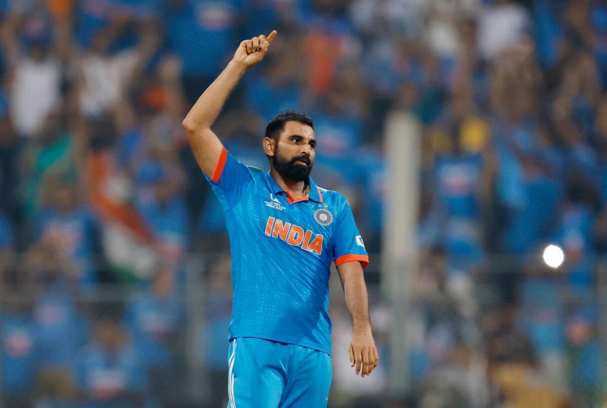 Mohammed Shami celebrates after taking the wicket of New Zealand's Lockie Ferguson. — Reuters