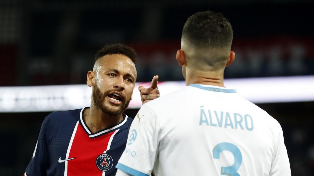 Paris St Germain's Neymar clashes with Olympique de Marseille's Alvaro Gonzalez