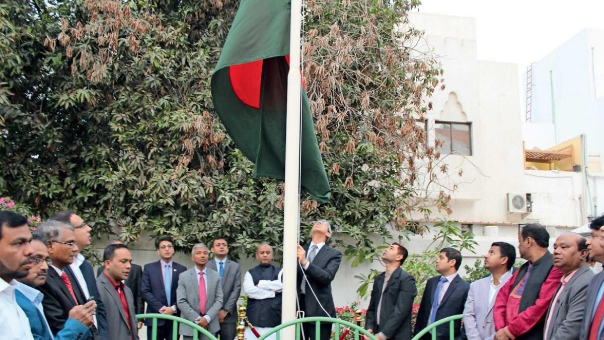 Muhammad Imran hoists the national flag to mark the 49th Independence Day celebrations held at the Bangladeshi embassy on Tuesday. — Supplied photo