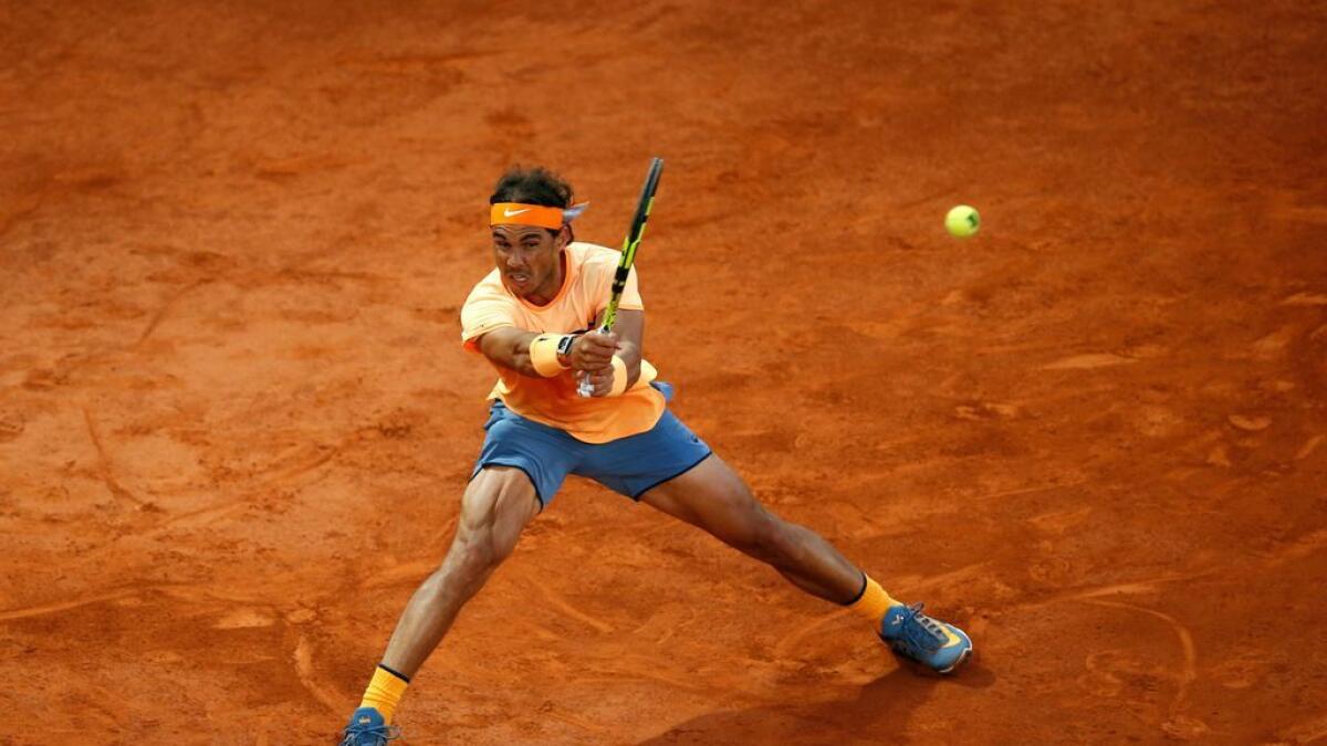 Rafael Nadal dropped a set before prevailing over Joao Sousa 6-0, 4-6, 6-3 in the Madrid Masters quaterfinals.