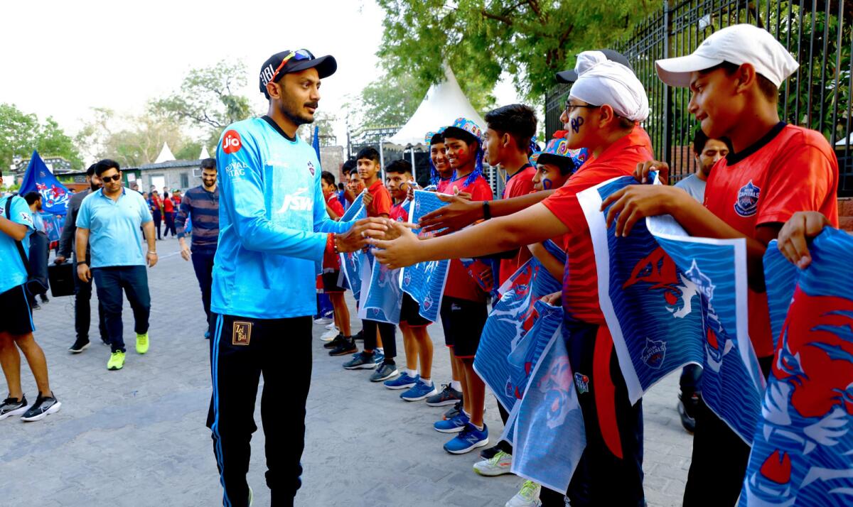 Axar Patel meets young cricketers during a Delhi Capitals event. — Supplied photo