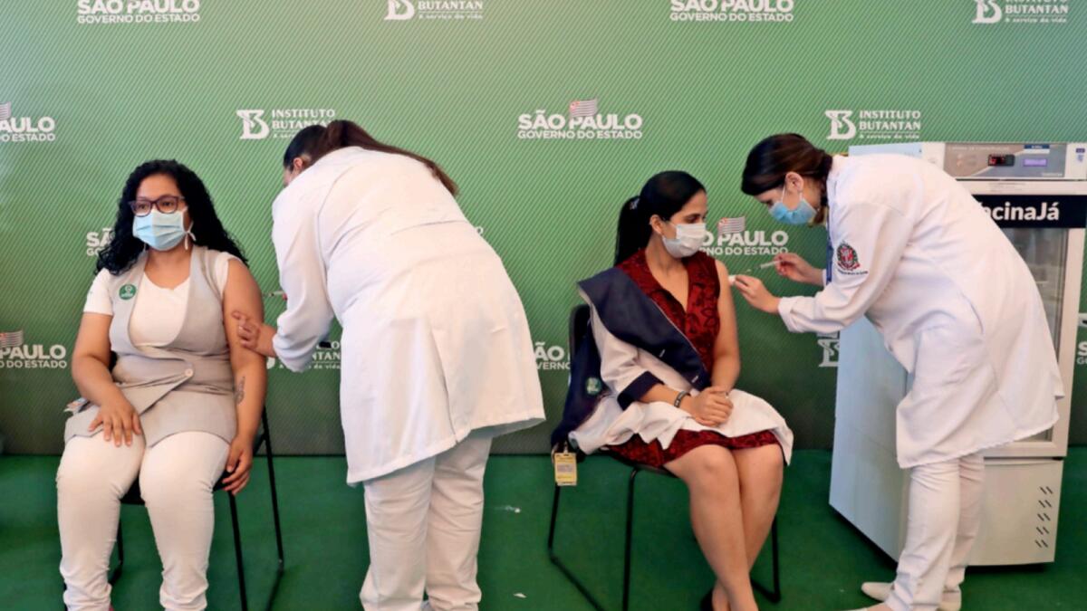 Healthcare workers receive a dose of the Sinovac vaccine at Hospital das Clinicas in Sao Paulo, Brazil. — Reuters