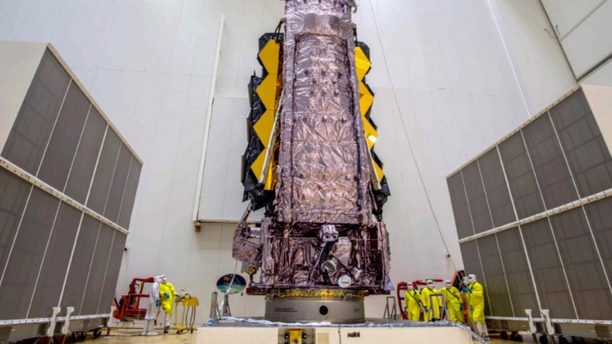 Nasa's James Webb Space Telescope is secured on top of the Ariane 5 rocket that will launch it to space from Europe's Spaceport in French Guiana. NASA Administrator Bill Nelson confirmed Friday that the James Webb Space Telescope will attempt to blast off on Christmas Eve. — AP