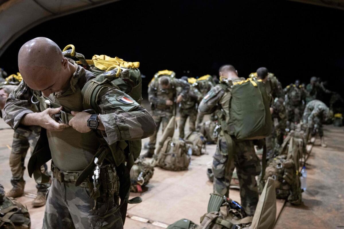 French soldiers of the 2e Regiment Etranger de Parachutistes (2eREP - 2nd Foreign Parachute Regiment ) prepare for a mission on the French BAP air base, in Niamey, on May 14, 2023.  — AFP
