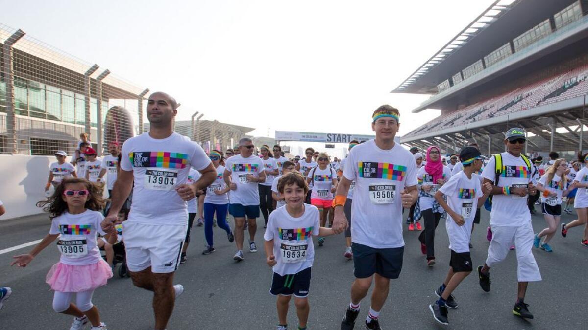 The kids and their parents are having a good time at the run. -Photo by Leslie Pableo/Khaleej Times