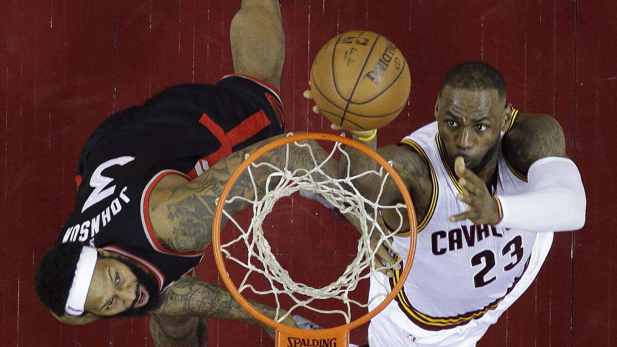 Cavaliers’ LeBron James (23) shoots against Raptors’ James Johnson (3) during Game 5 of NBA action. — AP