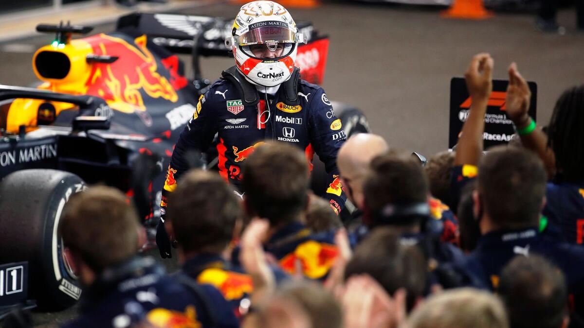 Red Bull Racing's Max Verstappen celebrates with the team after winning the Formula One Etihad Airways Abu Dhabi Grand Prix on Sunday. — Aston Martin Red Bull Racing Twitter