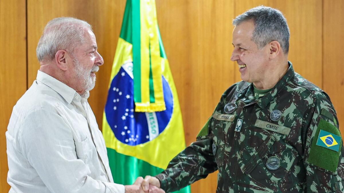 Brazilian President Luiz Inacio Lula da Silva shaking hands with the new Army commander, General Tomas Ribeiro Paiva in Brasilia on January 21, 2023. — AFP