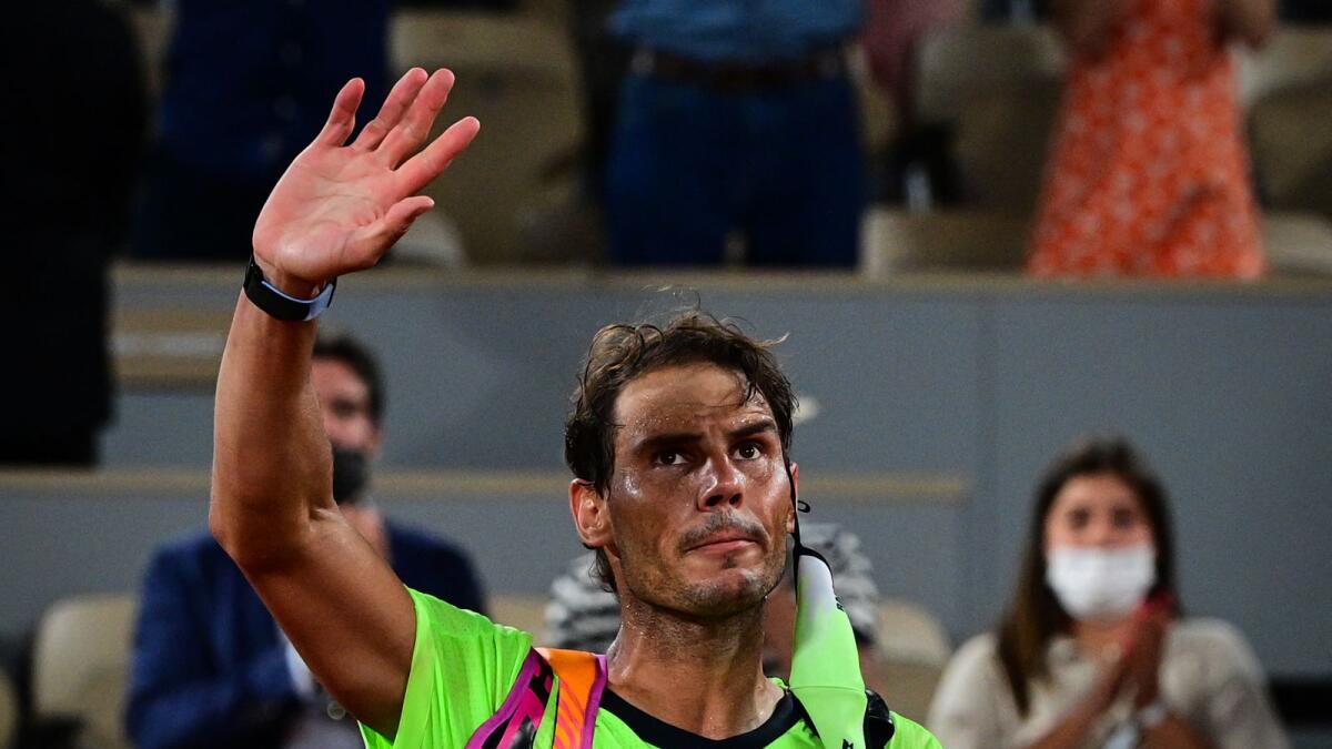 Rafael Nadal leaves the court after losing the semifinal against Novak Djokovic. (AFP)