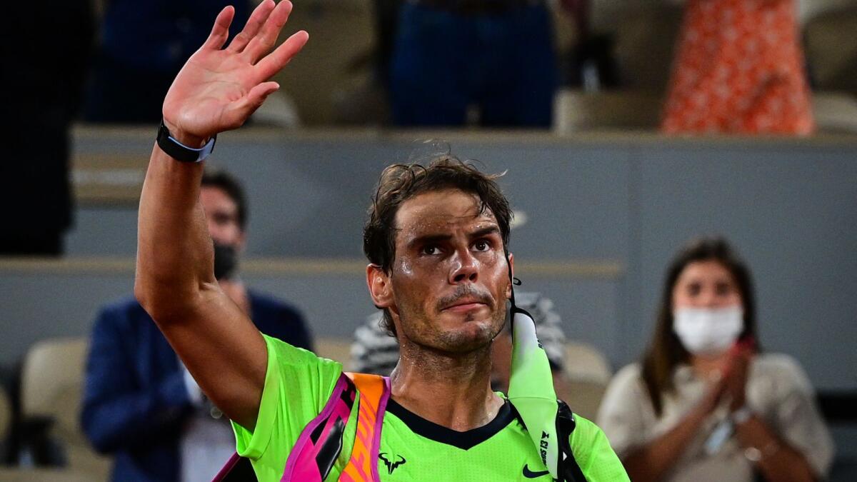 Rafael Nadal leaves the court after losing the semifinal against Novak Djokovic. (AFP)