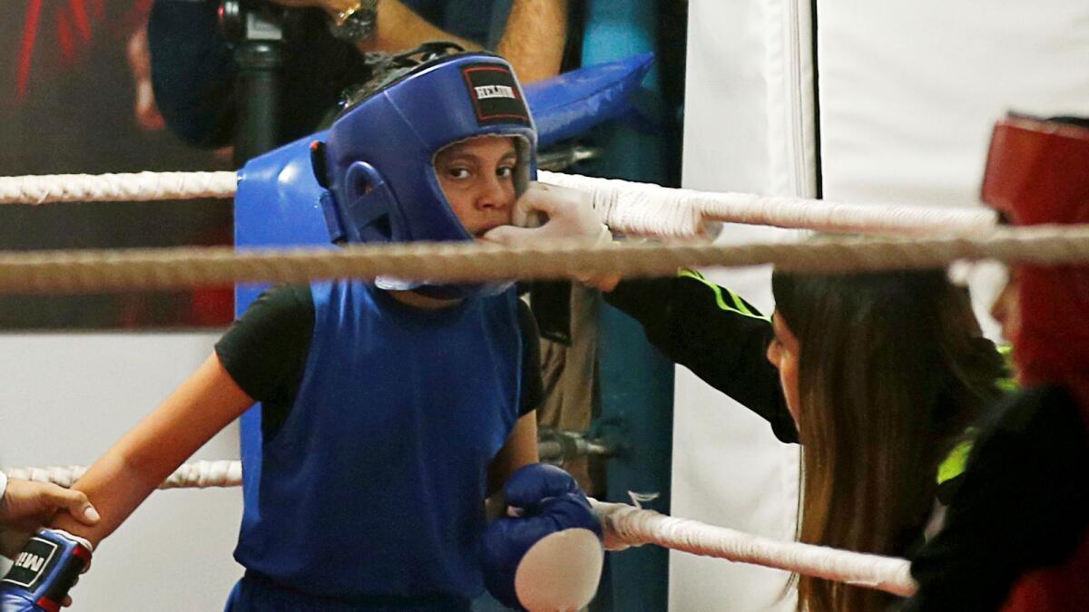 A Palestinian girl takes part in a rare boxing championship in Gaza City on Friday.