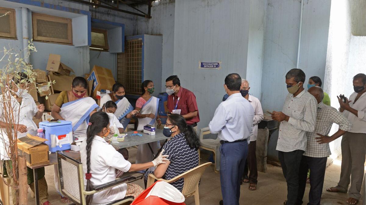 People queue up to get inoculated with the Covid-19 vaccine in Hyderabad. Photo: AFP