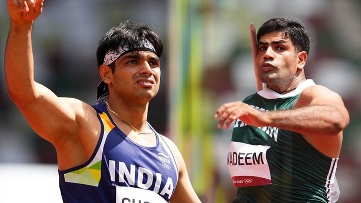 India's Neeraj Chopra and Pakistan's Arshad Nadeem during their qualifying rounds at the Tokyo Games on Wednesday. (Reuters)