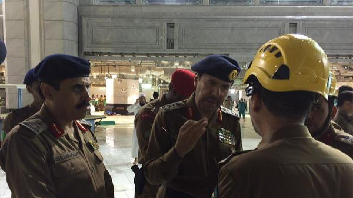 Saudi Civil Defense officials visit the site of the crane crash in Makkah's Grand Mosque.