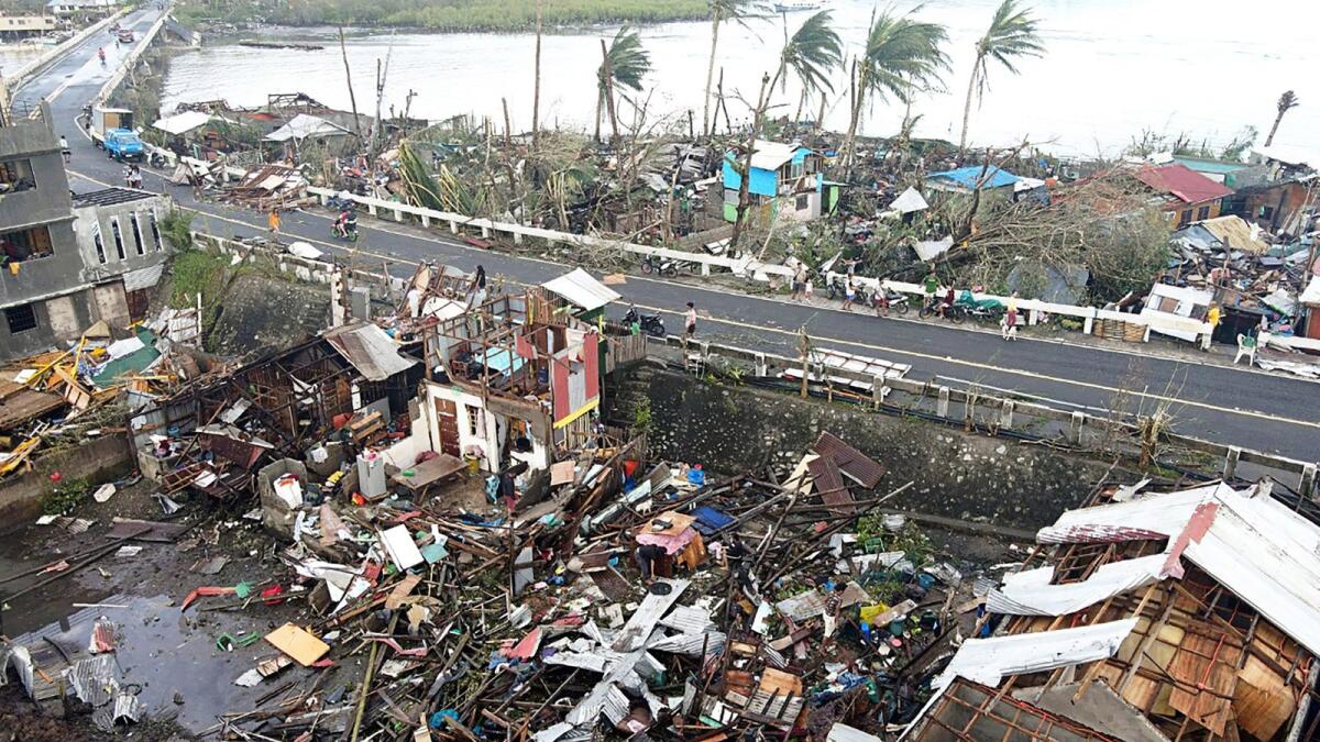 This aerial photo taken on December 17, 2021 shows destroyed houses caused by Super Typhoon Rai after the storm crossed over Surigao City in Surigao del Norte province. (Photo: AFP)