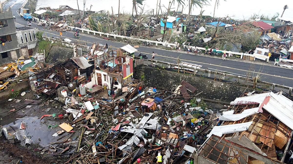 This aerial photo taken on December 17, 2021 shows destroyed houses caused by Super Typhoon Rai after the storm crossed over Surigao City in Surigao del Norte province. (Photo: AFP)