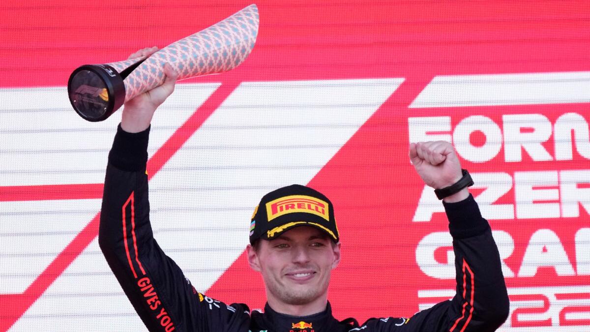Red Bull driver Max Verstappen of the Netherlands celebrates on the podium. (AP)