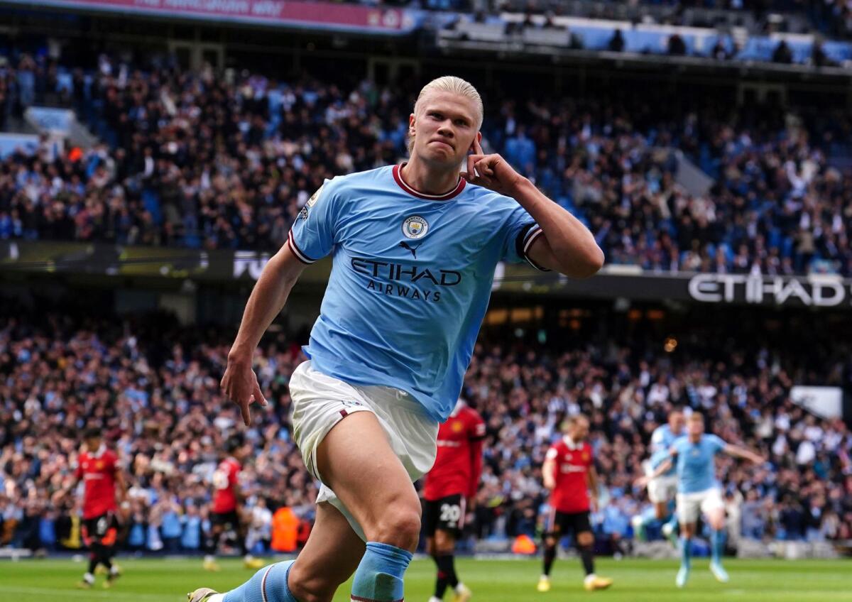 Manchester City's Erling Haaland celebrates after scoring his side's third goal against Manchester United. (AP)