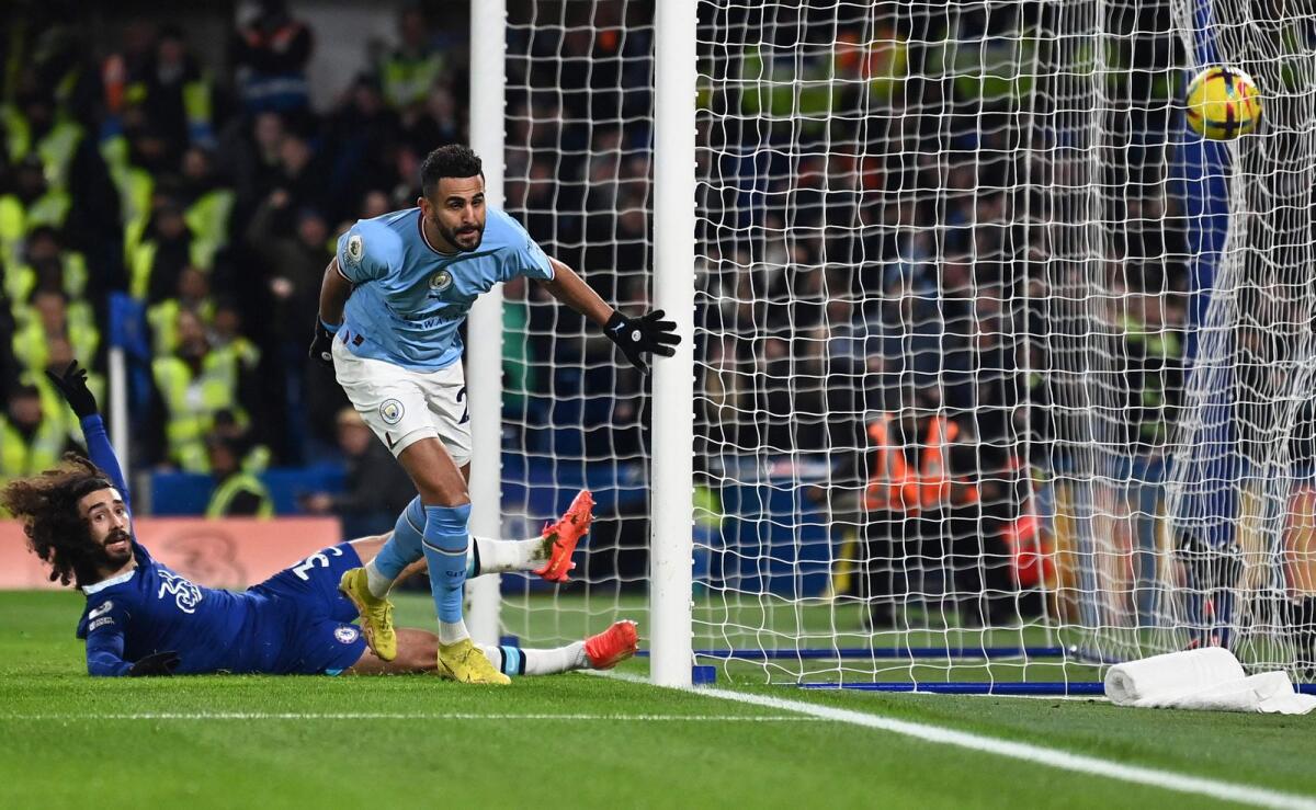 Manchester City's Riyad Mahrez celebrates after scoring a goal against Chelsea. — AFP