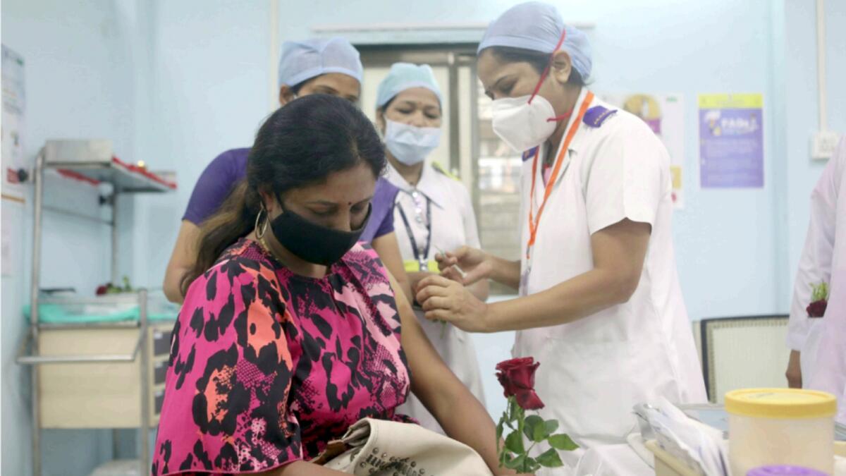 A healthcare worker receives Covid vaccine in Mumbai. — Reuters file