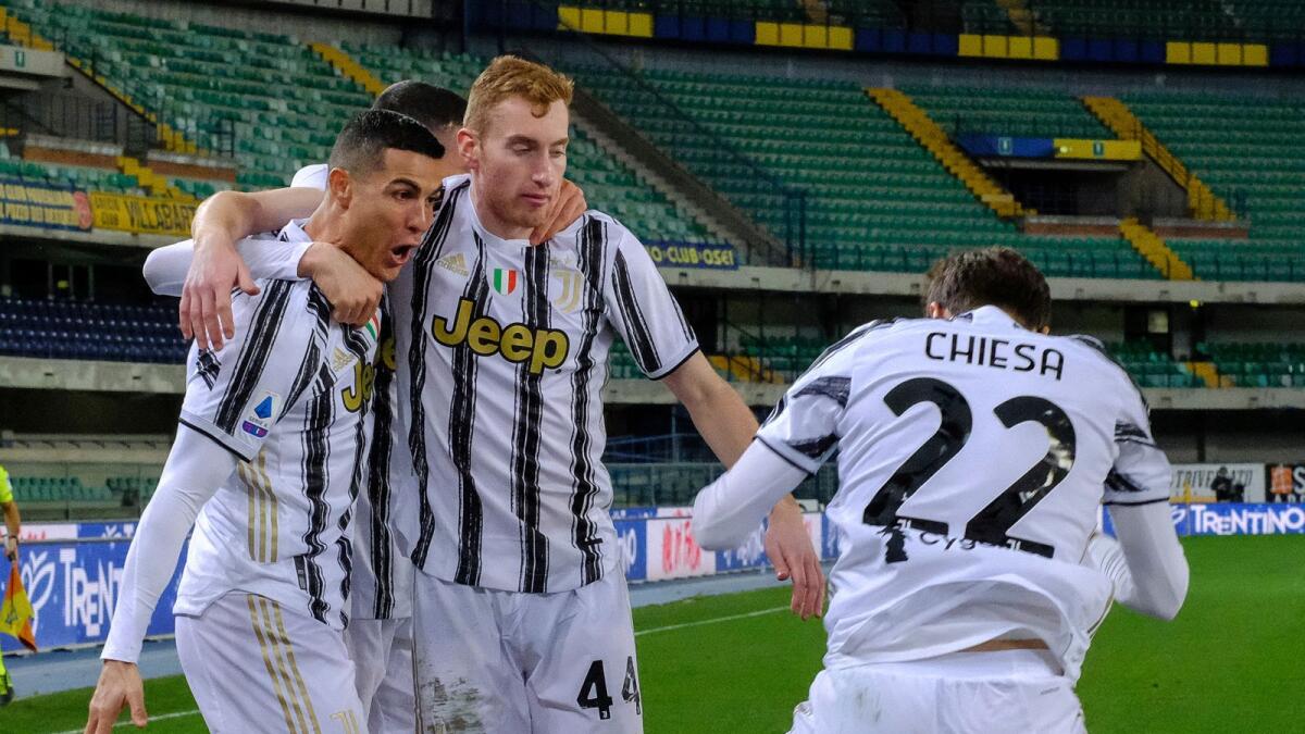 Cristiano Ronaldo celebrates his goal against Verona with his teammates. — Reuters