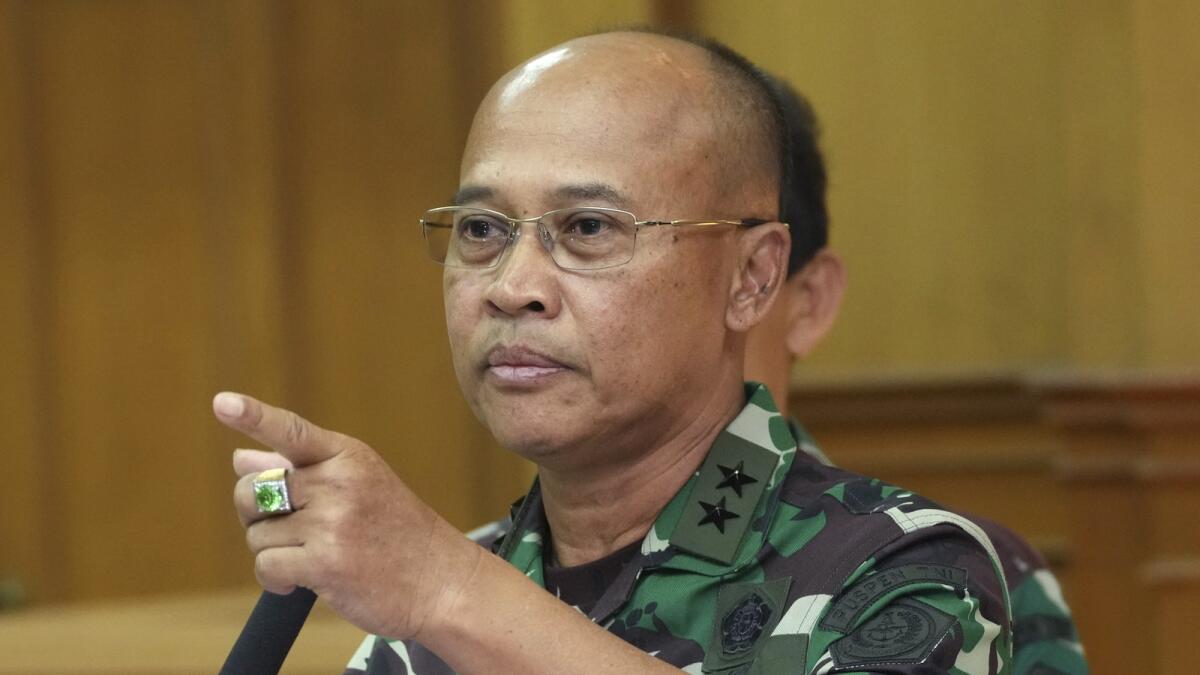 Indonesian military spokesman Rear Admiral Julius Widjojono gestures during a press conference at Indonesia military headquarter in Jakarta, Indonesia, on Sunday. — AP