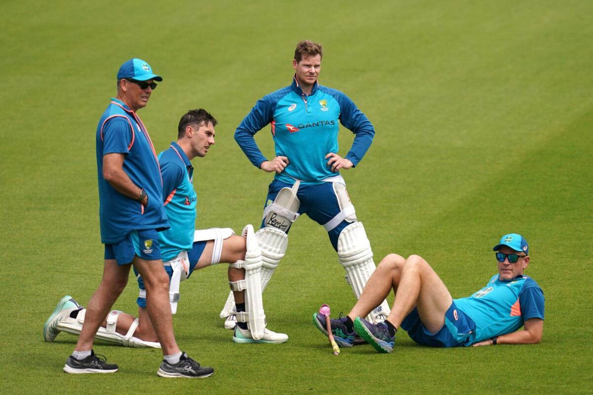Australia's Pat Cummins, Steve Smith and head coach Andrew McDonald during a nets session. — AP