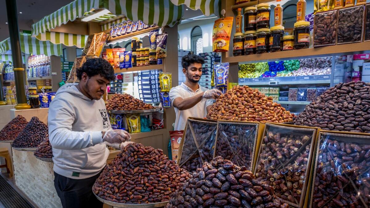 Vendors arrange dates at Sharjah's Souq Al Jubail in preparation of Ramadan. — Photos by Shihab