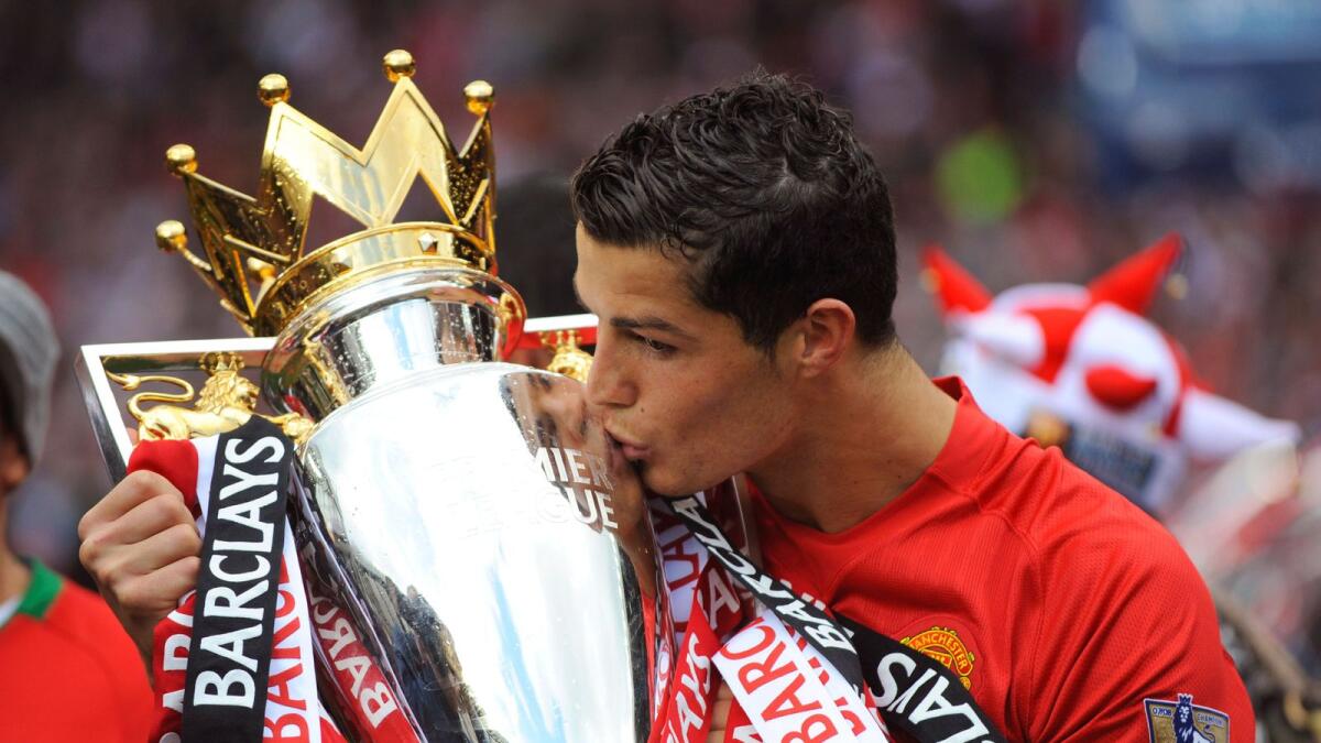 Portuguese superstar Cristiano Ronaldo kisses the trophy after winning the 2009 Premier League title with Manchester United.  (Reuters file)