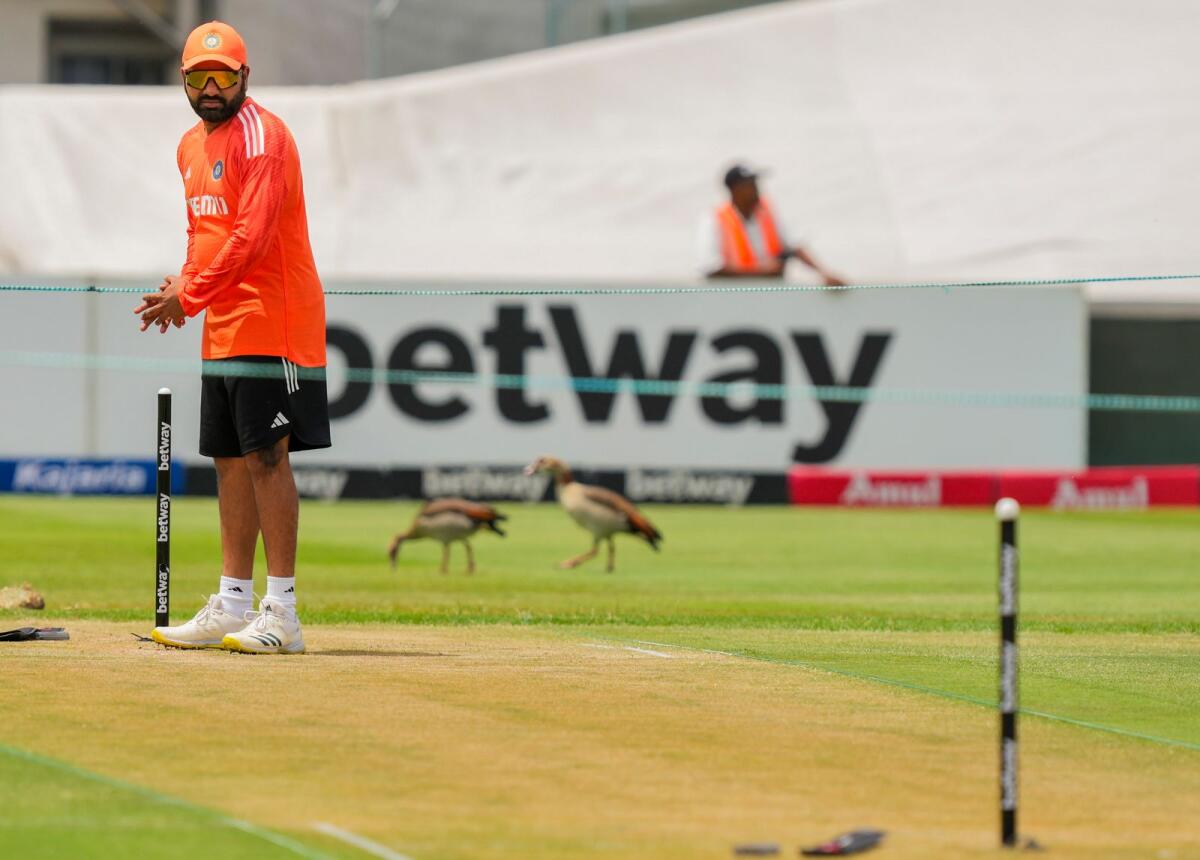 India's Rohit Sharma looks at the pitch during a practice session at the Newlands Cricket Ground in Cape Town on Tuesday. — PTI
