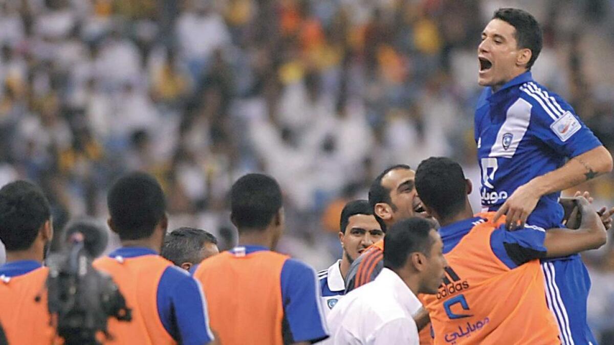 Thiago Neves celebrates with teammates after scoring in a previous league in the Gulf. 