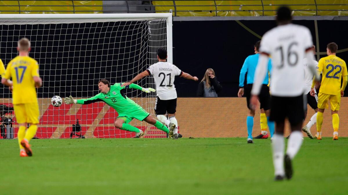 Ukraine's goalkeeper Andrey Pyatov (centre) fails to save the 3-1 scored by Germany's forward Timo Werner (not seen) during the Uefa Nations League match. — AFP