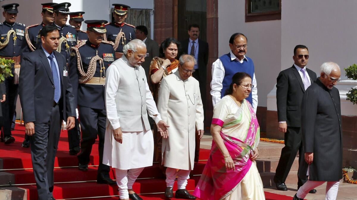 Indian Prime Minister Narendra Modi (centre L), President Pranab Mukherjee (centre R), Lok Sabha speaker Sumitra Mahajan (front, in saree) and Vice President Mohammad Hamid Ansari (R) walk inside the parliament premises as they arrive to attend the first day of the budget session in New Delhi, India, February 23, 2016.