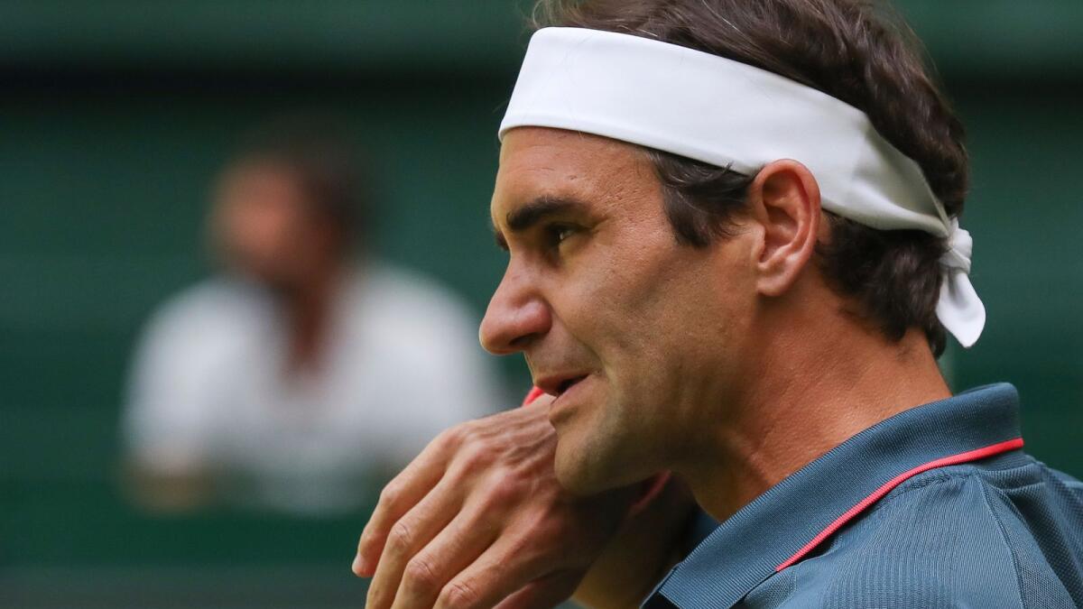 Roger Federer reacts during his match against Felix Auger-Aliassime in Halle. (AP)
