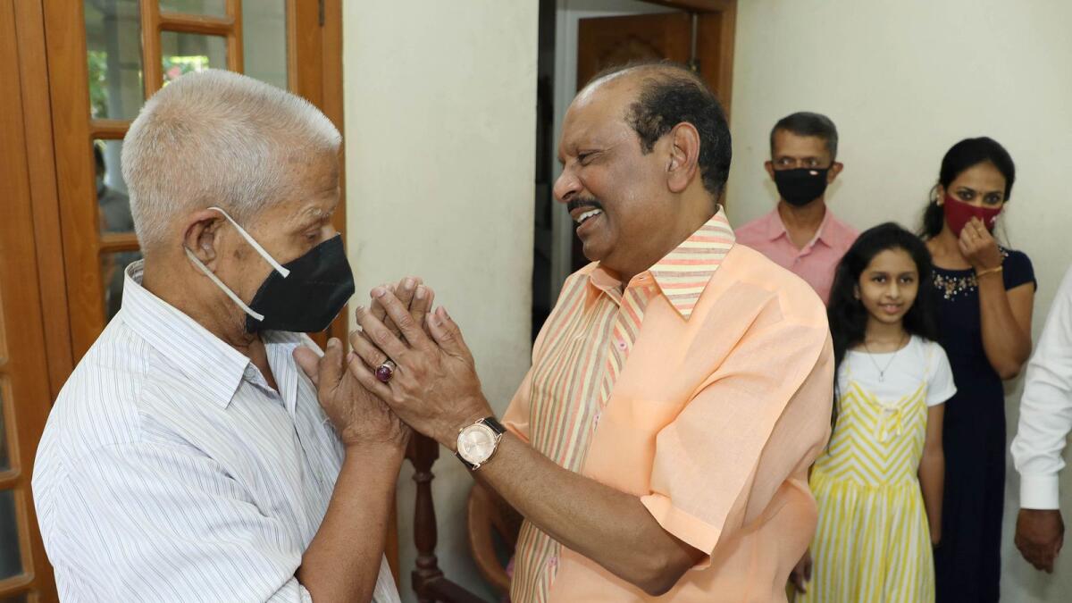 Lulu group chief, MA Yousafali, visits people who rescued him during a chopper crash in Kerala. Photo: Supplied