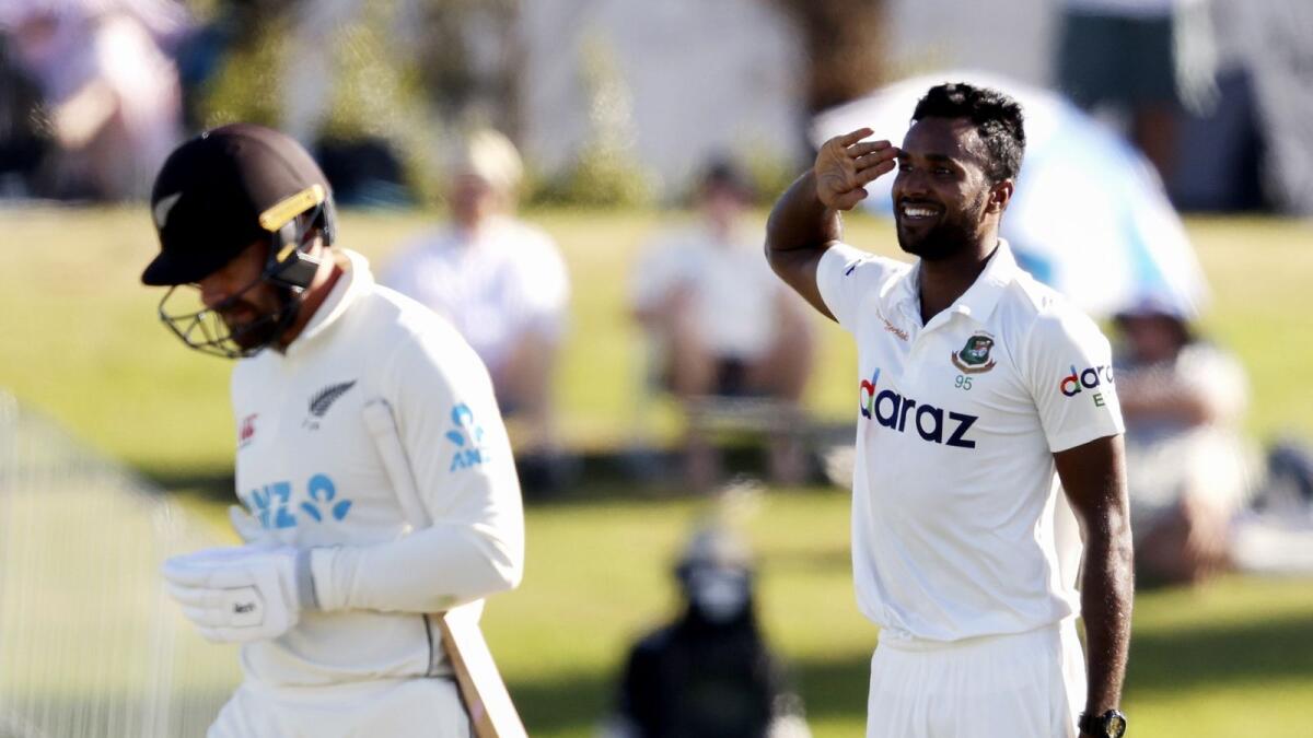 Bangladesh Ebadot Hossain (right) celebrates the wicket of New Zealand's Will Young. — AFP