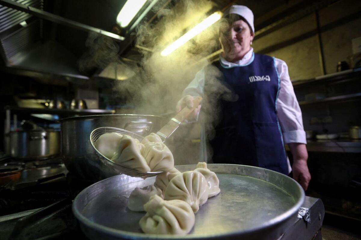 A cook demonstrates the preparation of the traditional Georgian dish Khinkali at a restaurant in Tbilisi, Georgia, on Monday. — Reuters