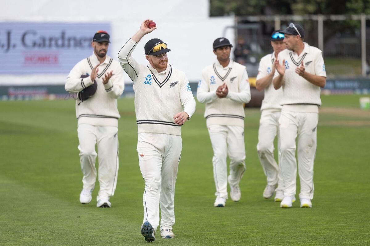 New Zealand's Glenn Phillips (C) celebrates his five wickets as he walks from the field at the end of the Australian 2nd innings. - AFP