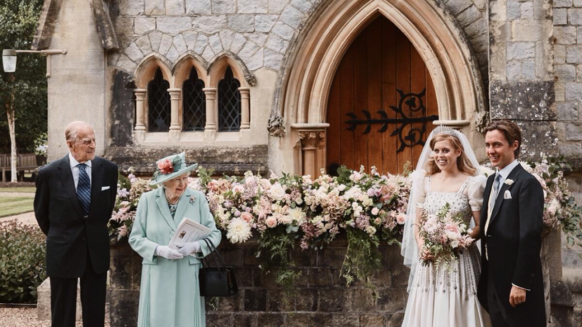 Britain's Princess Beatrice and Edoardo Mapelli Mozzi stand outside The Royal Chapel of All Saints at Royal Lodge after their wedding, with Britain's Queen Elizabeth II and Duke of Edinburgh, in Windsor, Britain, in this official wedding photograph released by the Royal Communications. Photo: Reuters