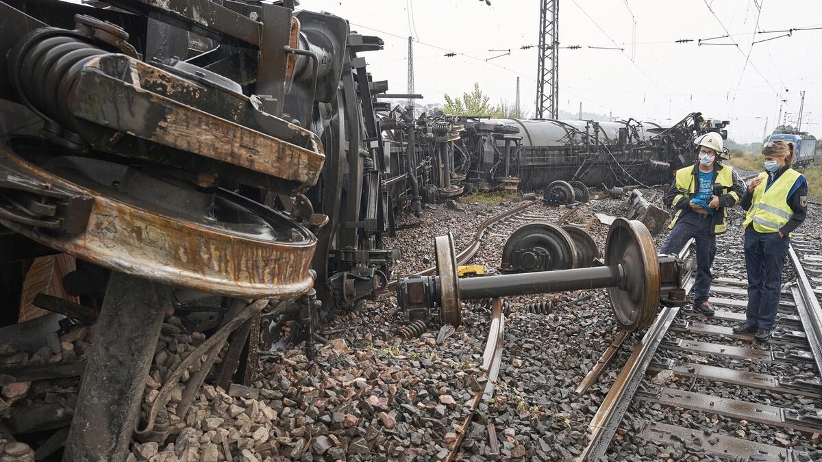 Tanker wagons lay on their side at the scene of a freight train accident near to Niederlahnstein station, Germany.  A freight train carrying biodiesel derailed on Sunday at the station, spilling up to 150,000 litres of fuel, according to a spokesperson for the federal police.  Photo: AP
