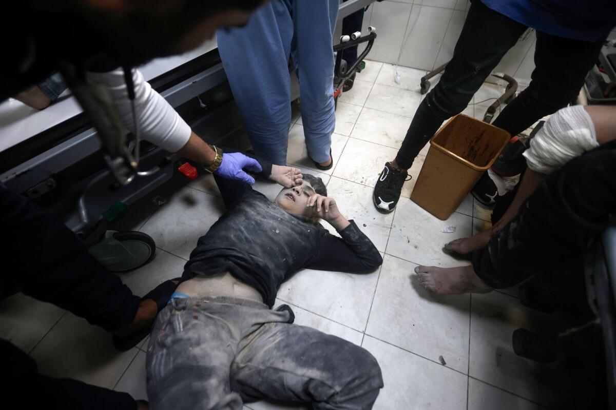 Palestinians wounded in Israeli bombardment, receive treatment at the hospital in Khan Younis refugee camp, southern Gaza Strip, on January 11, 2024. — AP